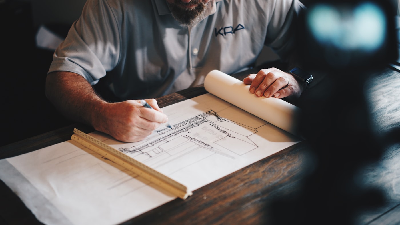 Technical drawings and plans on a desk